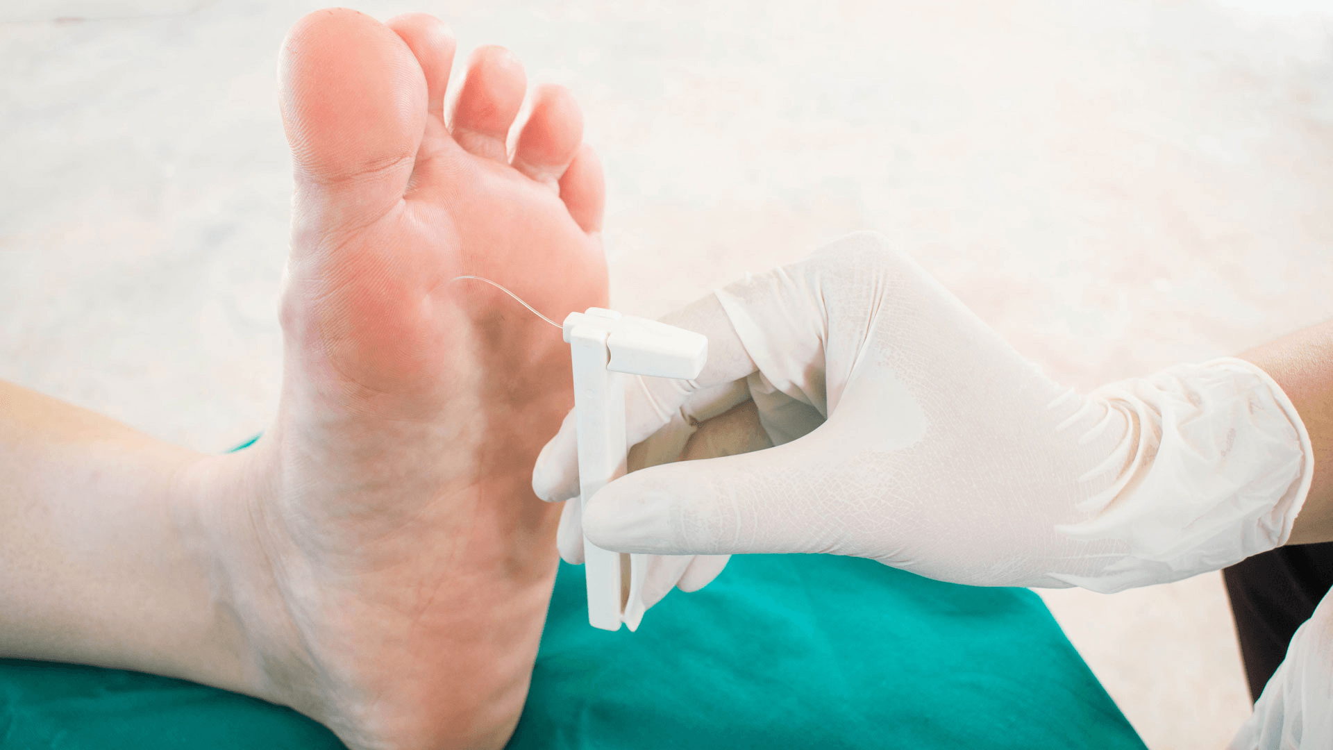 Foot healthcare professional examining a patient's foot